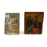 A Greek icon, 19th century, with silver oklad depicting George and the dragon, 20cm x 13.
