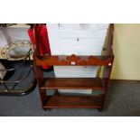 A set of 19th century satinwood hanging shelves, with carved crest and slab end sides, 64cm wide,