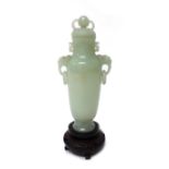 A Chinese pale celadon jade two-handled vase and cover, 20th century, of tapered cylindrical form,