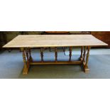 A 19th century and later pine kitchen table, with plank top and baluster supports,