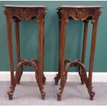 Probably Emile Galle; a pair of walnut Art Nouveau stands, 47cm x 106cm.