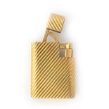 A 9ct gold Cartier London petrol lighter, of curved rectangular form,