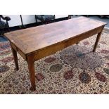 A 19th century French fruitwood kitchen table on tapering square supports, 71cm high x 206cm wide.