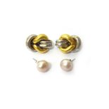 A pair of two colour gold earclips, each in an interlooped design, detailed 18 CT ITALY,