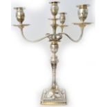 A silver four light three branch table candelabra, the base decorated with urns and pendant swags,