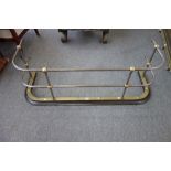 A 19th century brass and steel fender,