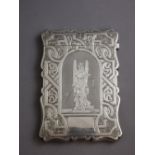 A Victorian silver card case of shaped rectangular form, engraved with strapwork,