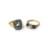 A gold, sapphire and colourless gem set three stone ring, detailed 9 CT,
