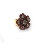 A gold, diamond and synthetic ruby ring, designed as a flowerhead,