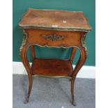 A Louis XV style gilt metal mounted kingwood two tier occasional table of serpentine outline,