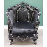 A large black painted and faux hide upholstered tub back armchair of Louis XV design,