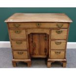 A George III mahogany kneehole writing desk, on bracket feet, 86cm wide x 76cm high.