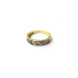 An 18ct gold and diamond five stone ring, mounted with a row of circular cut diamonds,