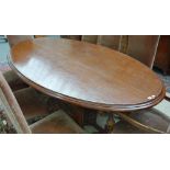 After Sir Edwin Lutyens; a teak oval dining table,