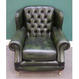 Thomas Lloyd; a 20th century green leather upholstered button back easy armchair,