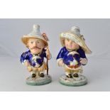 A pair of Royal Crown Derby dwarves, each commemorating Nelson's bicentennial anniversary,