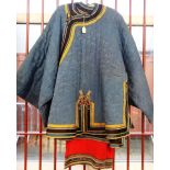 A Chinese embroidered blue ground jacket, early 20th century,
