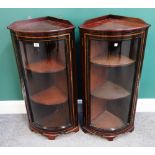 A pair of tulip wood banded walnut ebonised bowfront corner display cabinets,