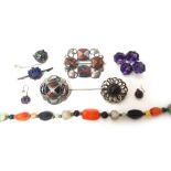 An amethyst set four stone brooch, two vary coloured agate set brooches,