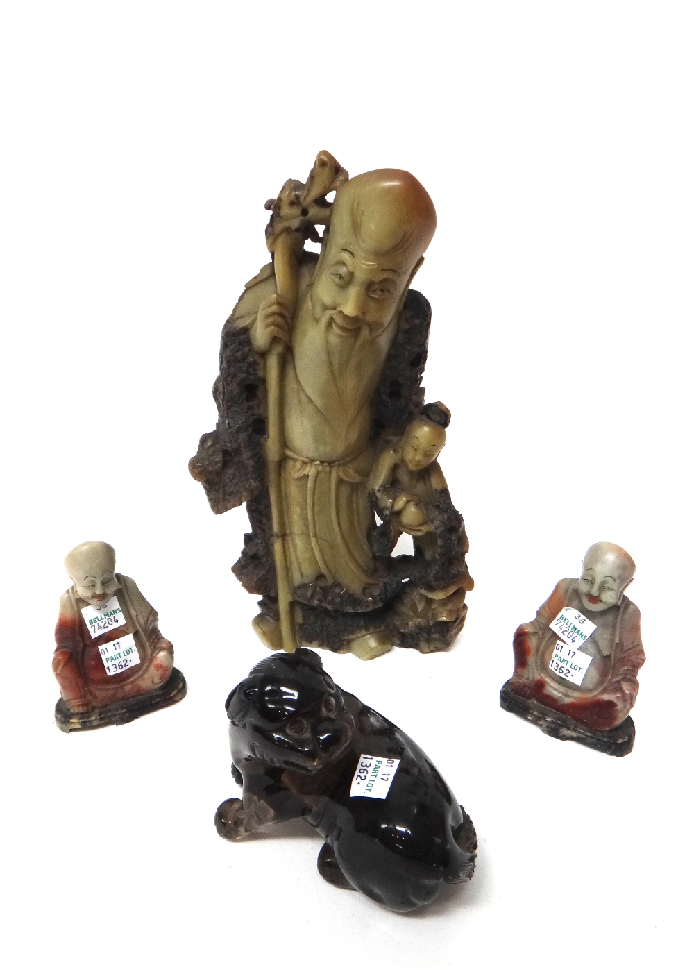 A soapstone carving of Shoulao, early 20th century, standing with a staff,