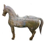 A large carved and painted figure of a standing horse (distressed), 158cm long x 160cm high.