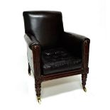 A William IV mahogany square back studded leather upholstered easy armchair on lappet carved front