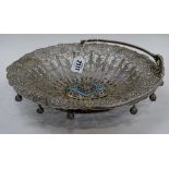 A filigree oval bread or cake basket, the panels decorated with flowers,