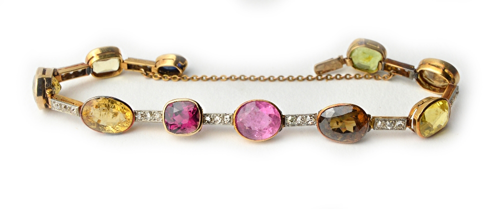 A gold, diamond and vary coloured gemstone set bracelet,
