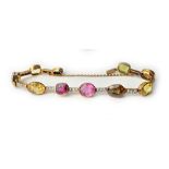 A gold, diamond and vary coloured gemstone set bracelet,