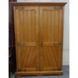 John Taylor & Son, Edinburgh; a Victorian Gothic Revival brass mounted ash two door wardrobe,