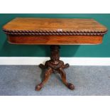 An early Victorian style rosewood tea table, on carved column and four downswept supports,