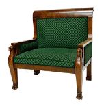 A French Empire style walnut framed armchair of large proportions,