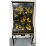 A George I black Japanned chinoiserie decorated bureau cabinet, on club supports and pad feet,