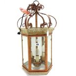 A modern polychrome decorated wrought metal hall lantern of hexagonal form,