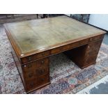 A large Victorian oak pedestal partners' desk with twelve various drawers and opposing cupboards,