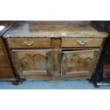 An early 19th century French chestnut buffet, with pair of drawers over cupboards,