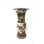 A Chinese beaker vase (gu), painted in a famille-verte palette with birds amongst flowering shrubs,