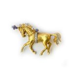 An 18ct gold, diamond and sapphire set brooch, designed as a performing circus horse,