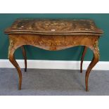 A Victorian gilt metal mounted figured walnut marquetry inlaid card table of serpentine outline,