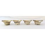 A set of four George III silver oval salts, each crest engraved and on an oval foot, London 1805,