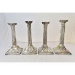 Two pairs of similar table candlesticks, possibly German, first half of the 19th century,