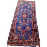 A Sarough rug, Persian, the indigo field with a madder rosette, pink spandrels,
