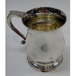 A silver christening mug, of baluster form, having a flat topped scrolling handle, Sheffield 1967,