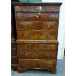 A George II walnut chest-on-chest of three short and six long graduated drawers, on bracket feet,