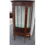 An Edwardian inlaid mahogany bowfront display cabinet, on splayed supports, 103cm wide x 181cm high.