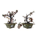 A pair of Chinese green ground cloisonné jardinieres with hardstone flowering trees,