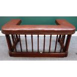 A 19th century club fender, with studded brown leather top over turned mahogany base,