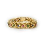 A gold, ruby, sapphire and emerald set bracelet, in a two row ropetwist link design,