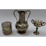A Continental twin handled baluster vase embossed with cherubs, flower baskets and swags,