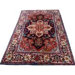 A Mahal rug, Persian, the black field with a bold ivory medallion, madder spandrels,